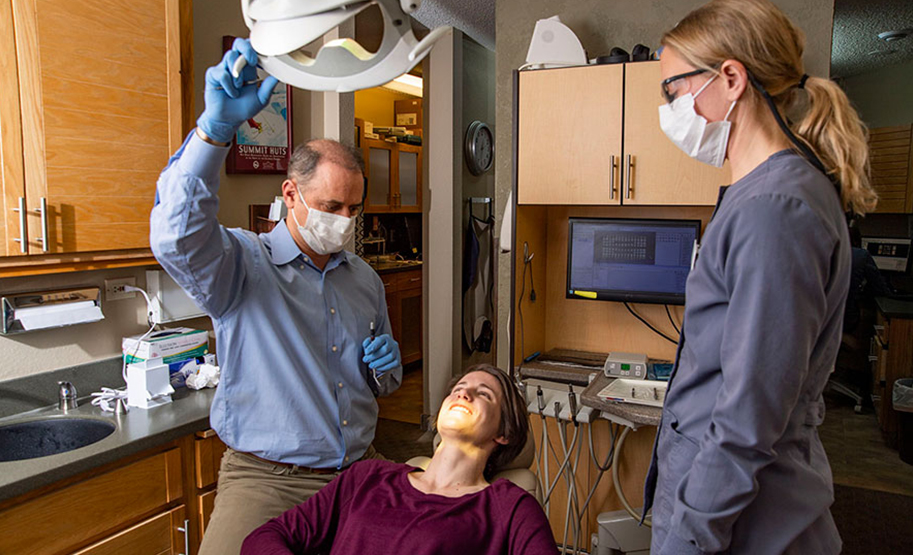 Dentists operating on patient